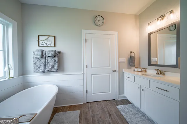 a bed room with a bed and a television