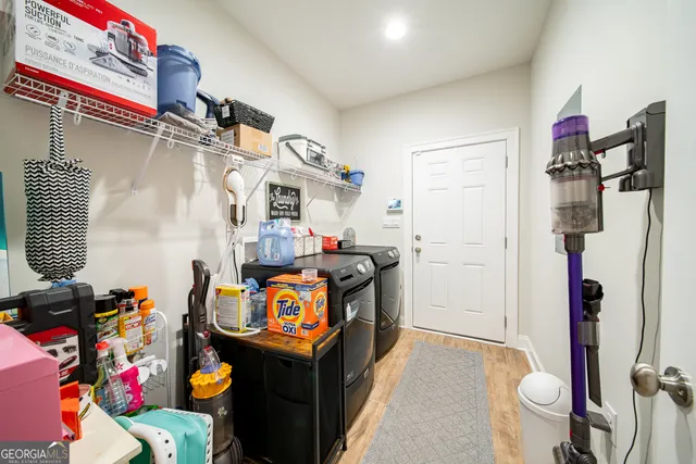 a bathroom with a sink a toilet and shower curtain