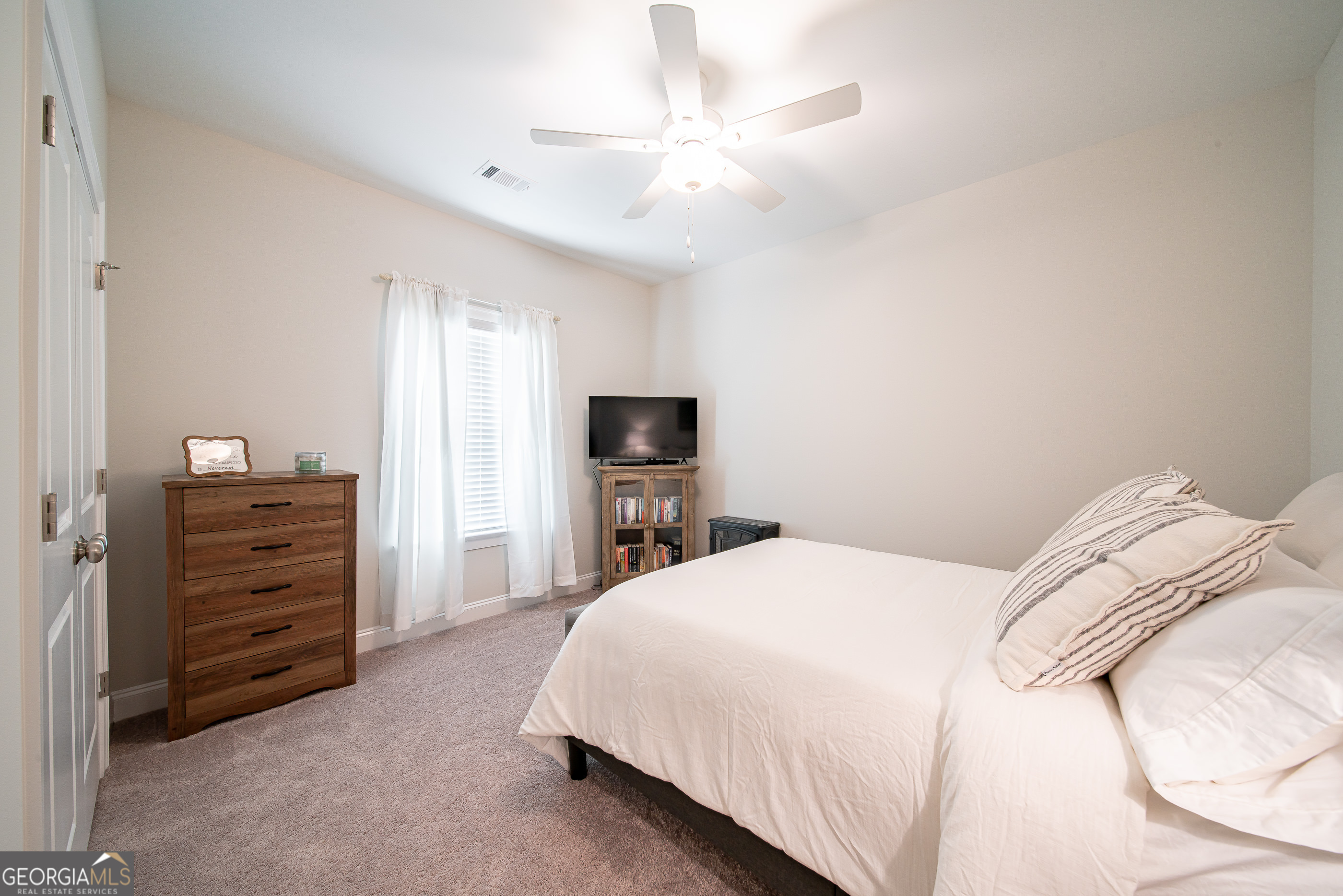 96 Cypress Trail Fortson, GA 31808 - Photo 56 of 62 a bedroom with a bed and a television