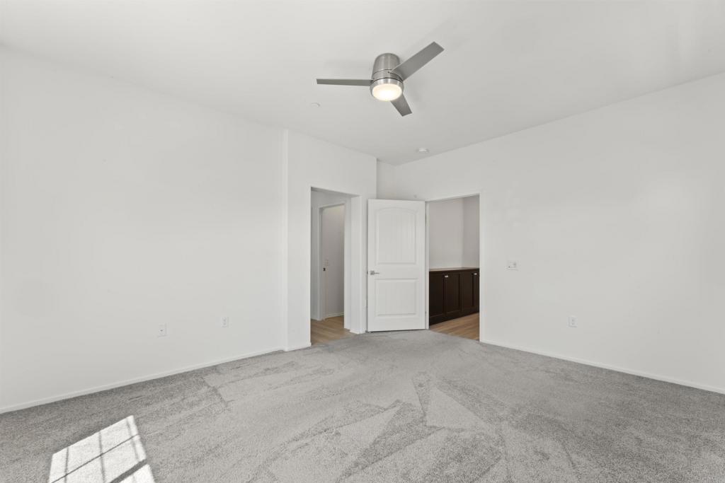 30320 Town Square Drive Menifee, CA 92584 - Photo 13 of 28 an empty room with closet and windows