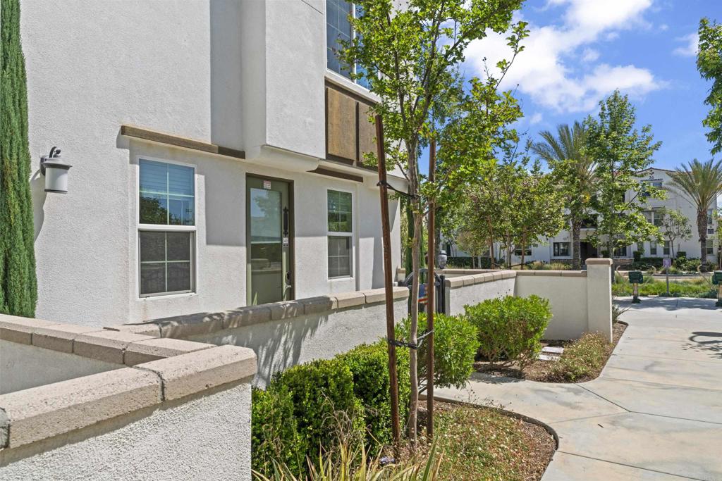 30320 Town Square Drive Menifee, CA 92584 - Photo 20 of 28 a front view of a house with garden