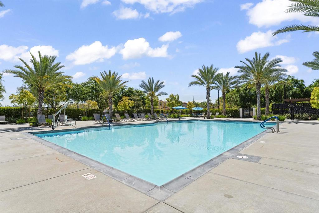 30320 Town Square Drive Menifee, CA 92584 - Photo 21 of 28 a view of swimming pool with outdoor seating and house in the background