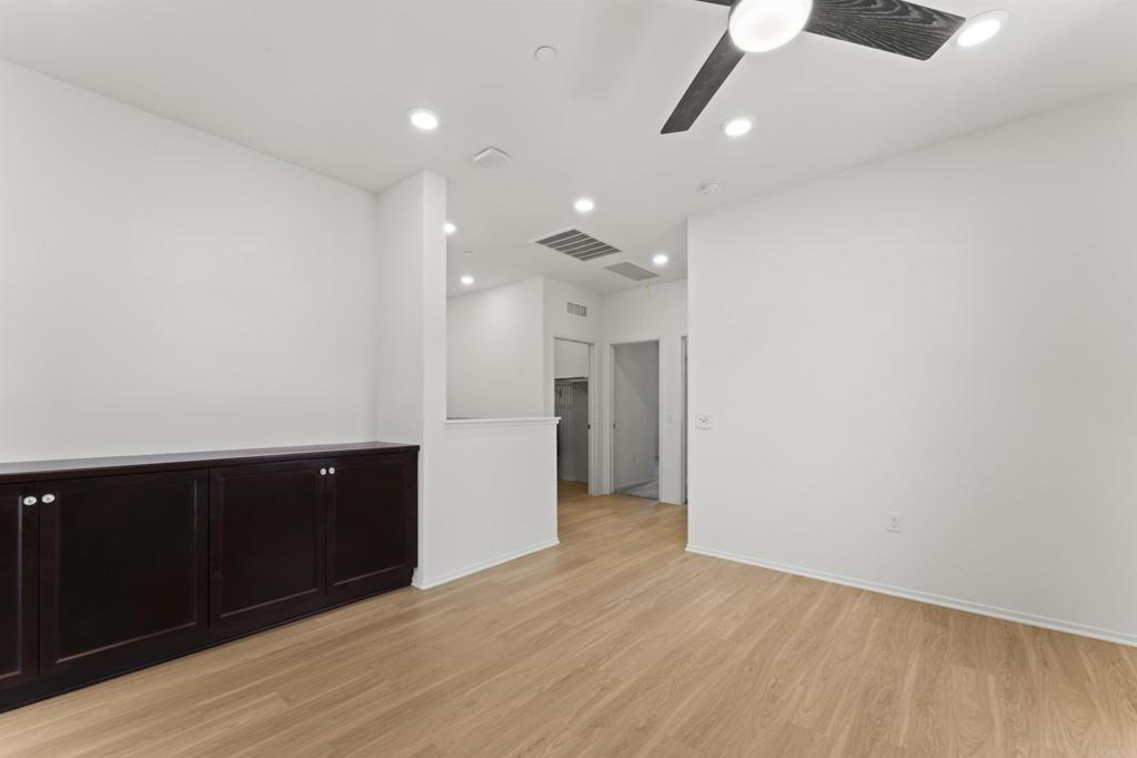 30320 Town Square Drive Menifee, CA 92584 - Photo 8 of 28 an empty room with wooden floor