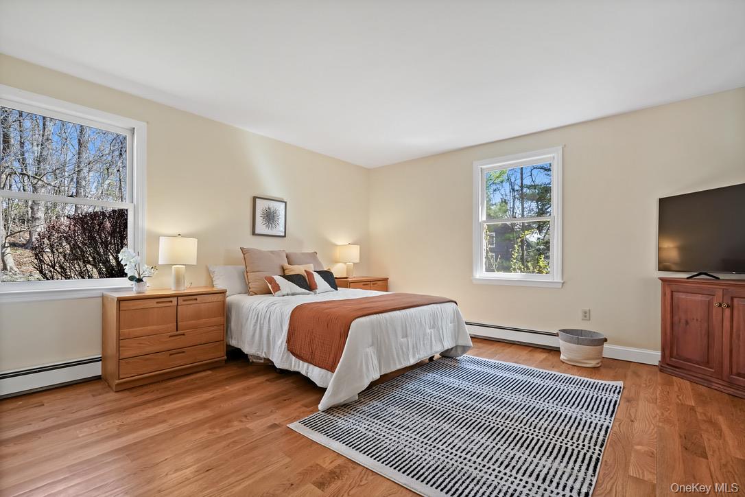 55 Greenmeadow Road Pleasantville, NY 10570 - Photo 11 of 23 Large first floor primary bedroom with triple exposure.