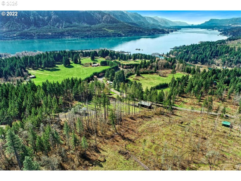 Kelly-henke Rd Homevalley Wa 98648 Stevenson, WA 98648 - Photo 16 of 23 a view of a lake with a yard and outdoor space