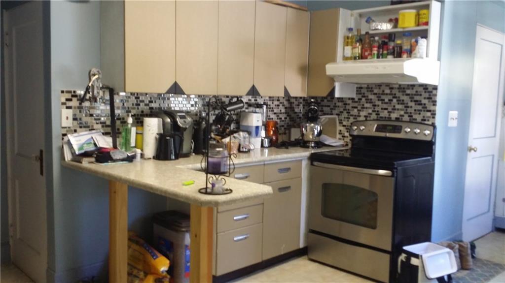 26 Weeman Street Springvale, ME 04083 - Photo 4 of 15 Your cozy kitchen with nice backsplash