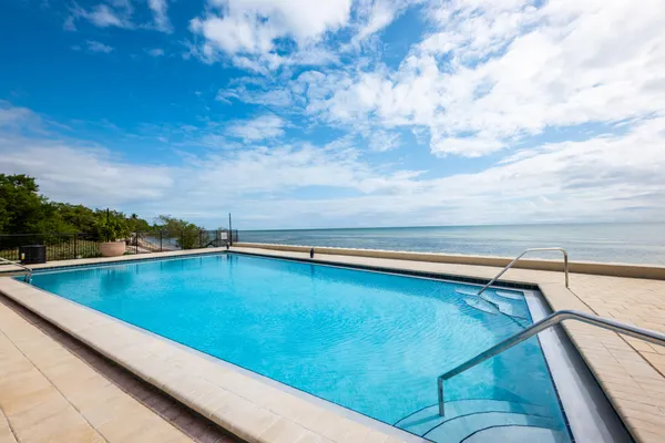 a view of swimming pool with seating area