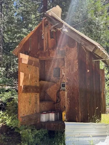 a view of a backyard with wooden fence