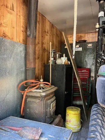 a view of a house with backyard porch and covered with snow