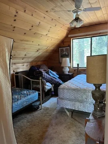 a bedroom with furniture and a fireplace