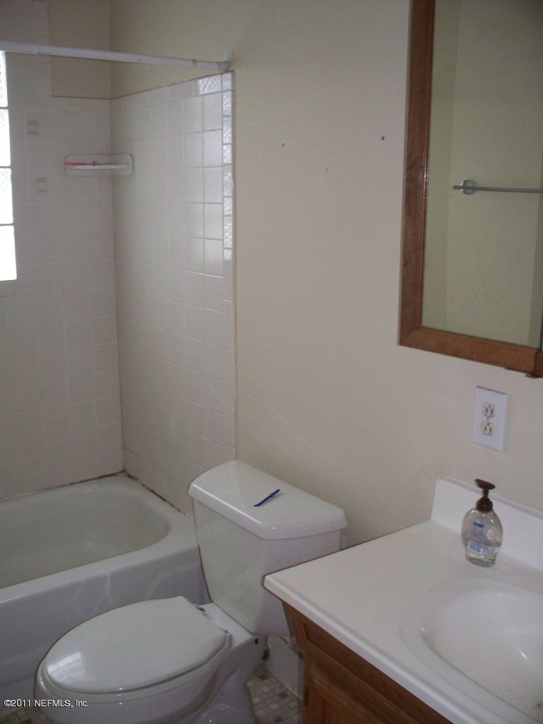 5752 Rover Drive Jacksonville, FL 32244 - Photo 11 of 16 a bathroom with a sink a toilet and shower