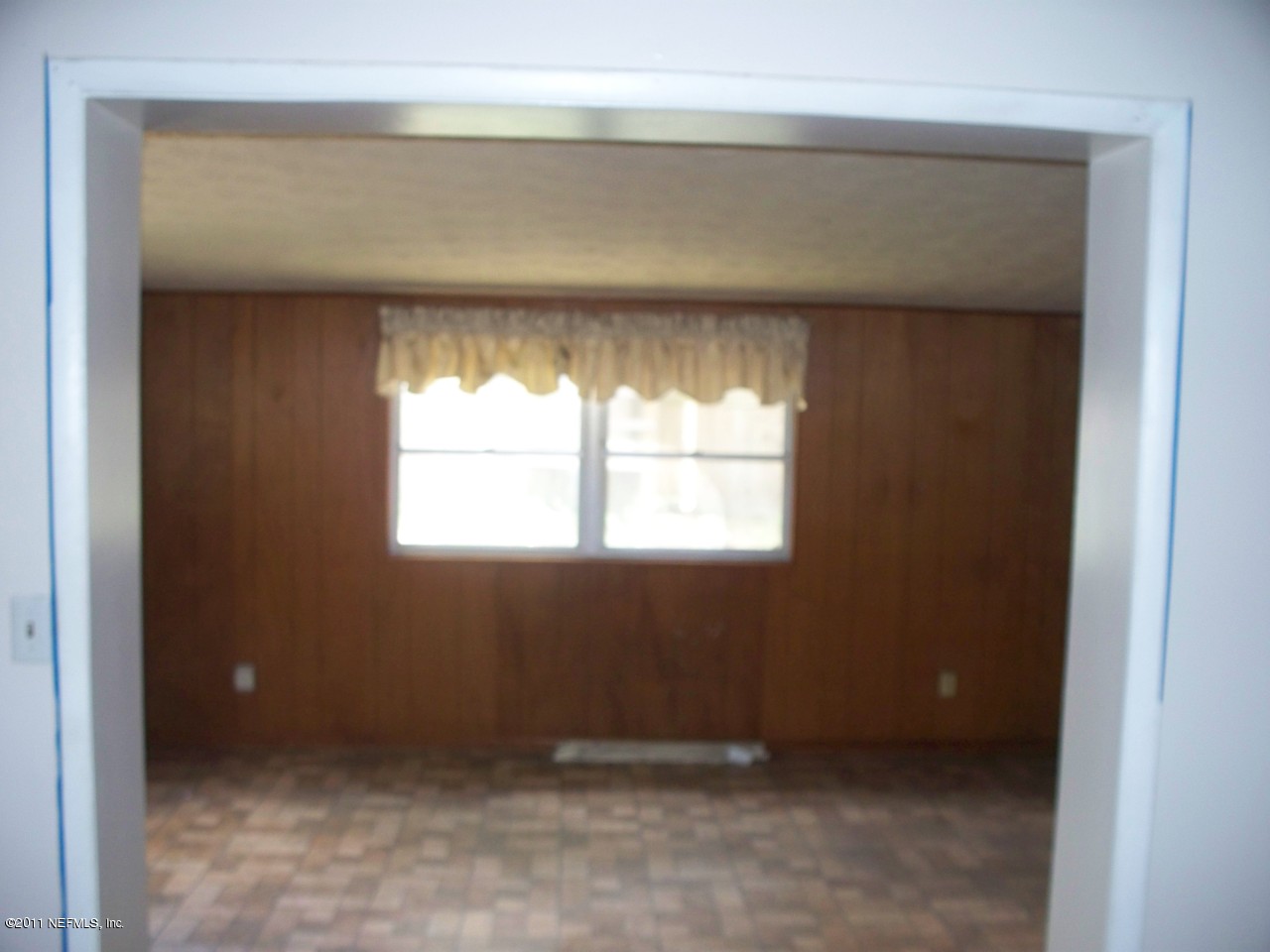 5752 Rover Drive Jacksonville, FL 32244 - Photo 4 of 16 a view of an empty room with a window