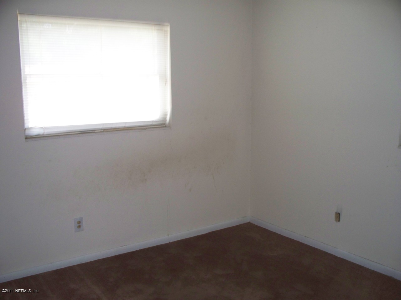 5752 Rover Drive Jacksonville, FL 32244 - Photo 6 of 16 an empty room with a window