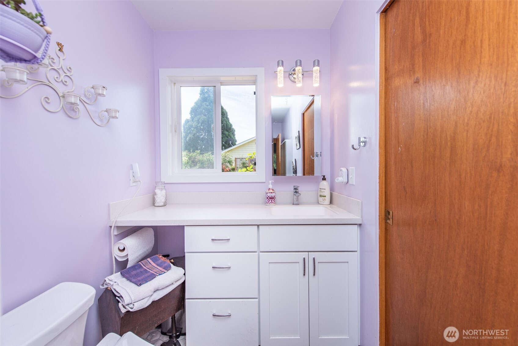 307 East Fir Street Sequim, WA 98382 - Photo 19 of 29 a bathroom with a sink a mirror and a toilet