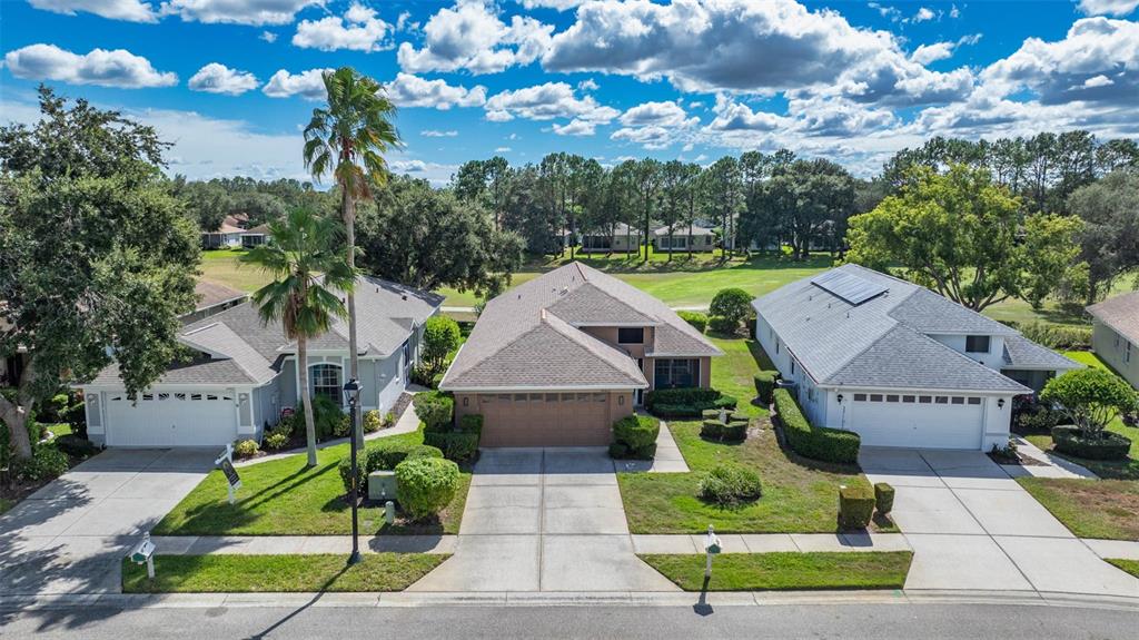 14462 Tamarind Loop Spring Hill, FL 34609 - Photo 1 of 28 a view of house with a garden