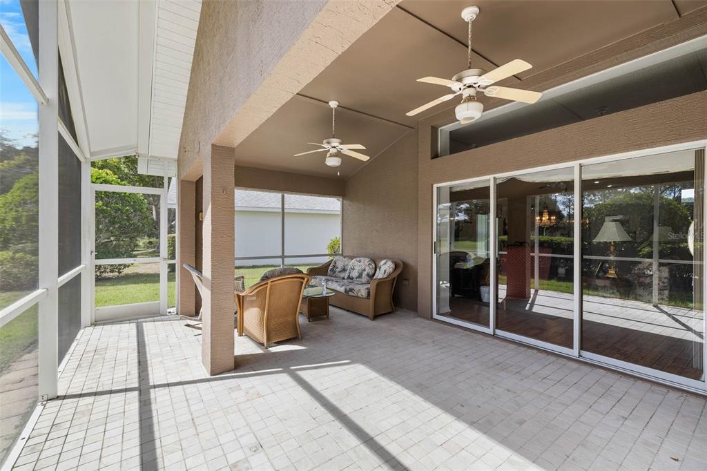 14462 Tamarind Loop Spring Hill, FL 34609 - Photo 19 of 28 a living room with furniture and a large window