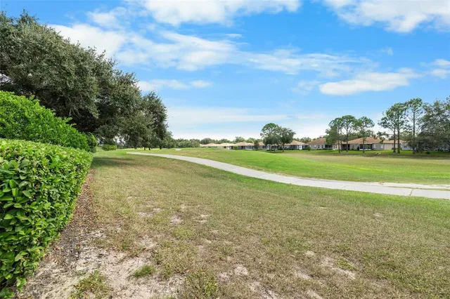 a view of a golf course with a lake