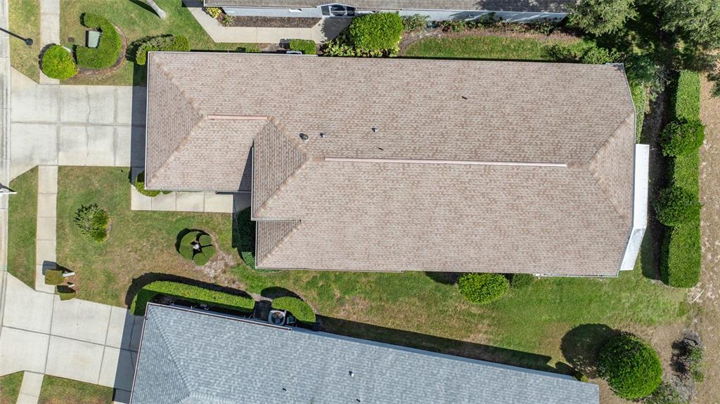 14462 Tamarind Loop Spring Hill, FL 34609 - Photo 27 of 28 an aerial view of a house with a yard