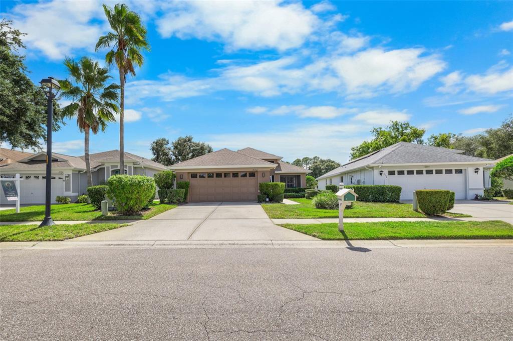 14462 Tamarind Loop Spring Hill, FL 34609 - Photo 28 of 28 a sign on the side of the road