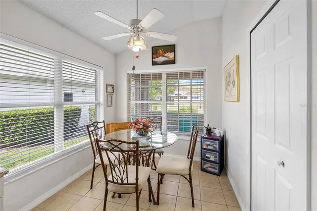 a dining room with furniture and window