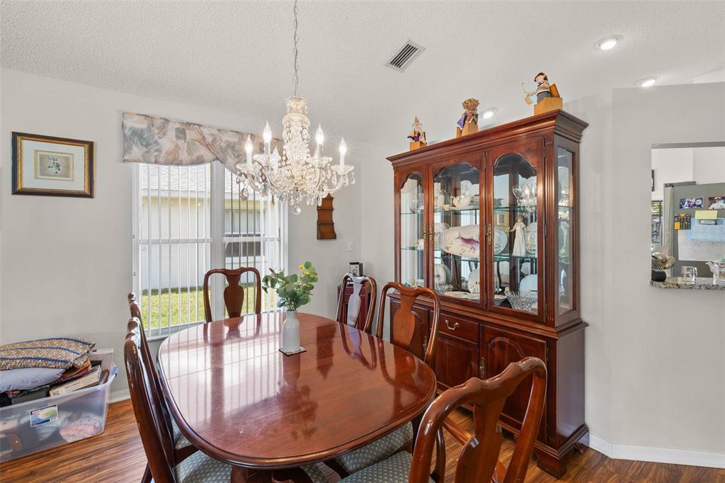 14462 Tamarind Loop Spring Hill, FL 34609 - Photo 10 of 28 a view of a dining room with furniture window and outside view