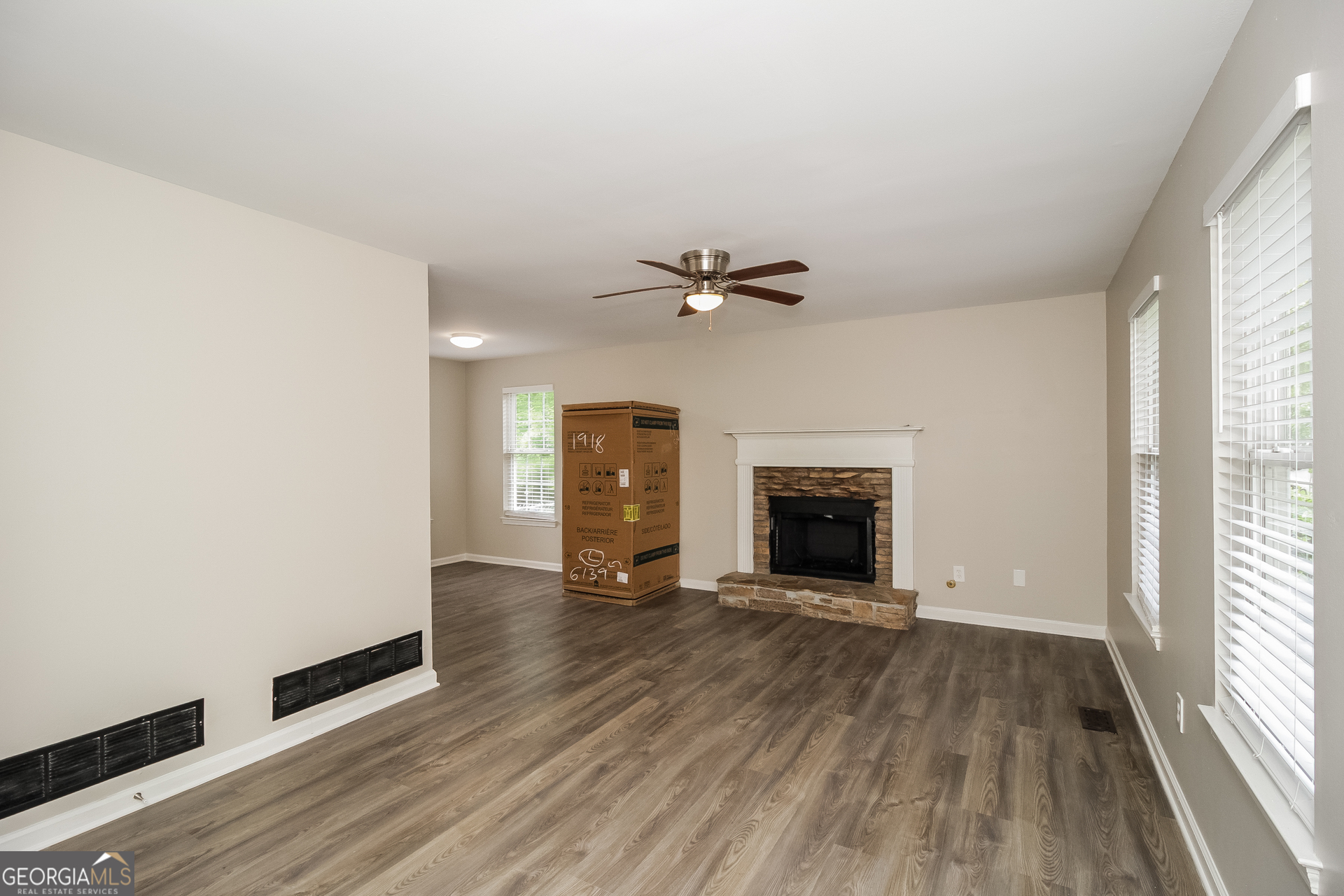 266 Amy Boulevard Temple, GA 30179 - Photo 4 of 17 a view of an empty room with a window and wooden floor