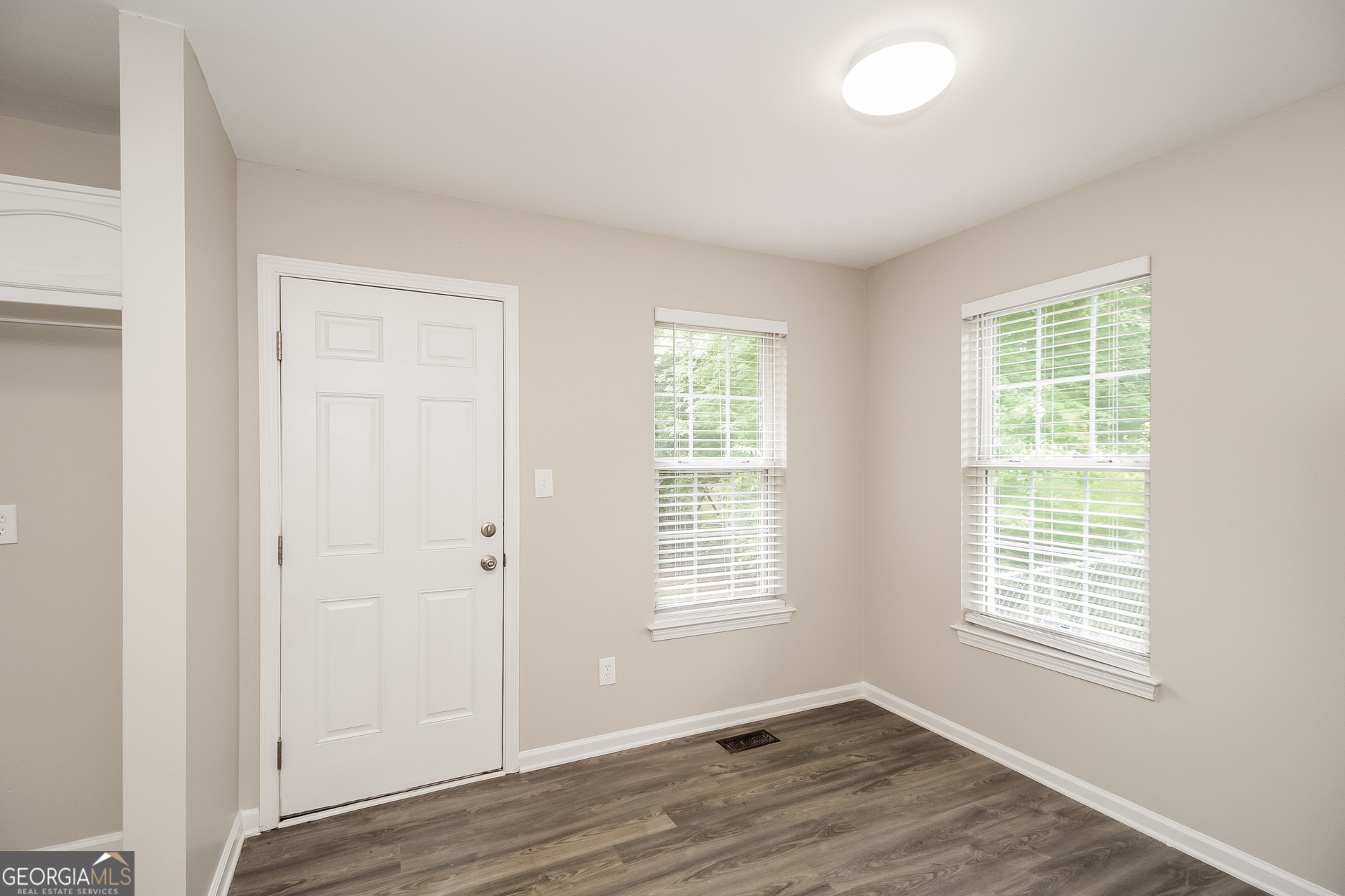 266 Amy Boulevard Temple, GA 30179 - Photo 6 of 17 an empty room with wooden floor and windows