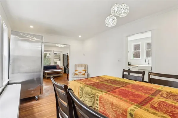 a bedroom with a bed and a table with chair