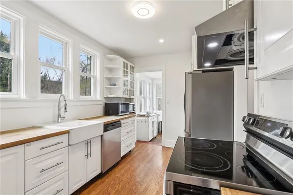 a kitchen with a sink stove and refrigerator