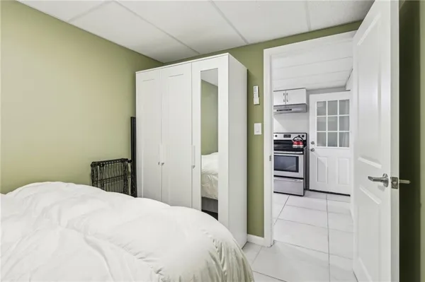 a bedroom with a bed and a shower