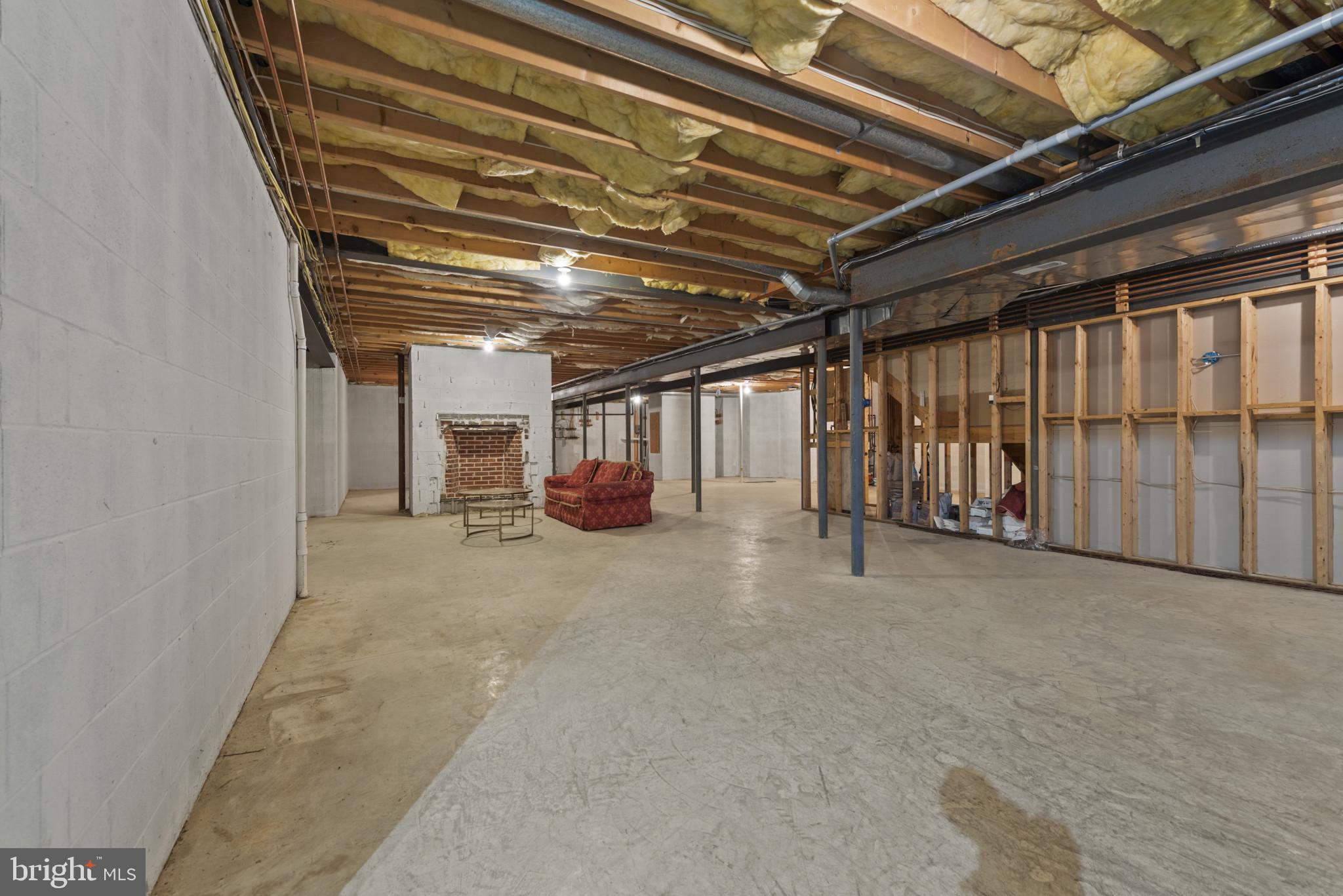7810 Ruxwood Road Ruxton, MD 21204 - Photo 80 of 94 Unfinished Lower level with fireplace.
