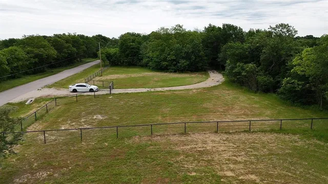 a backyard of a house with lots of green space