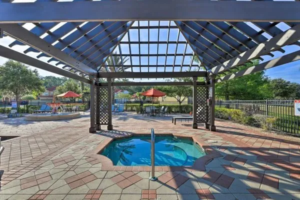a view of a swimming pool with a patio