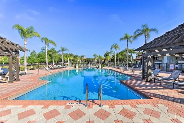 a view of a swimming pool with a lounge chairs
