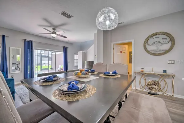 a view of a dining room and livingroom with furniture