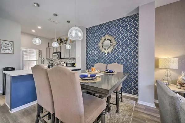 a living room with furniture and a clock