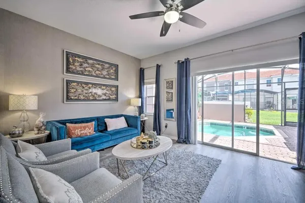 a living room with furniture and a large window