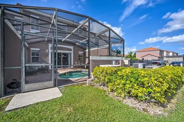 a view of a swimming pool with a patio