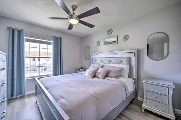 a bedroom with a bed and a window