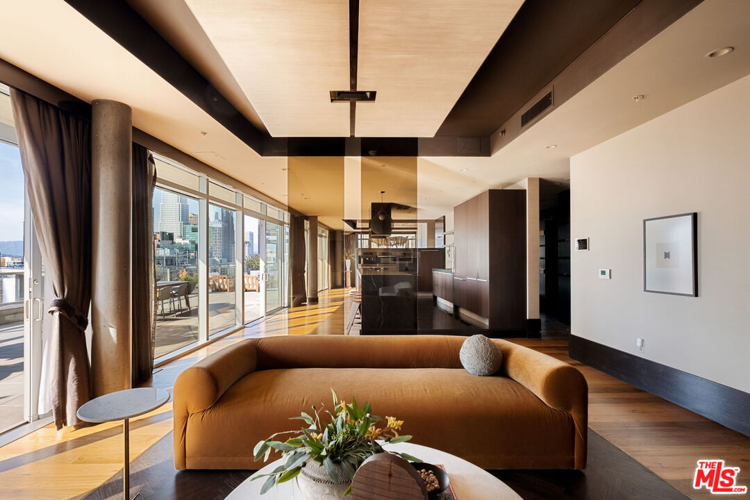 1155 South Grand Avenue, Unit 2204 Los Angeles, CA 90015 - Photo 17 of 50 a living room with furniture and a large window