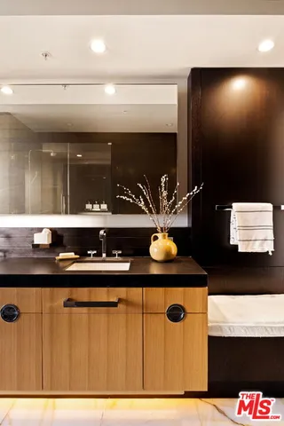 a bathroom with a sink and a mirror