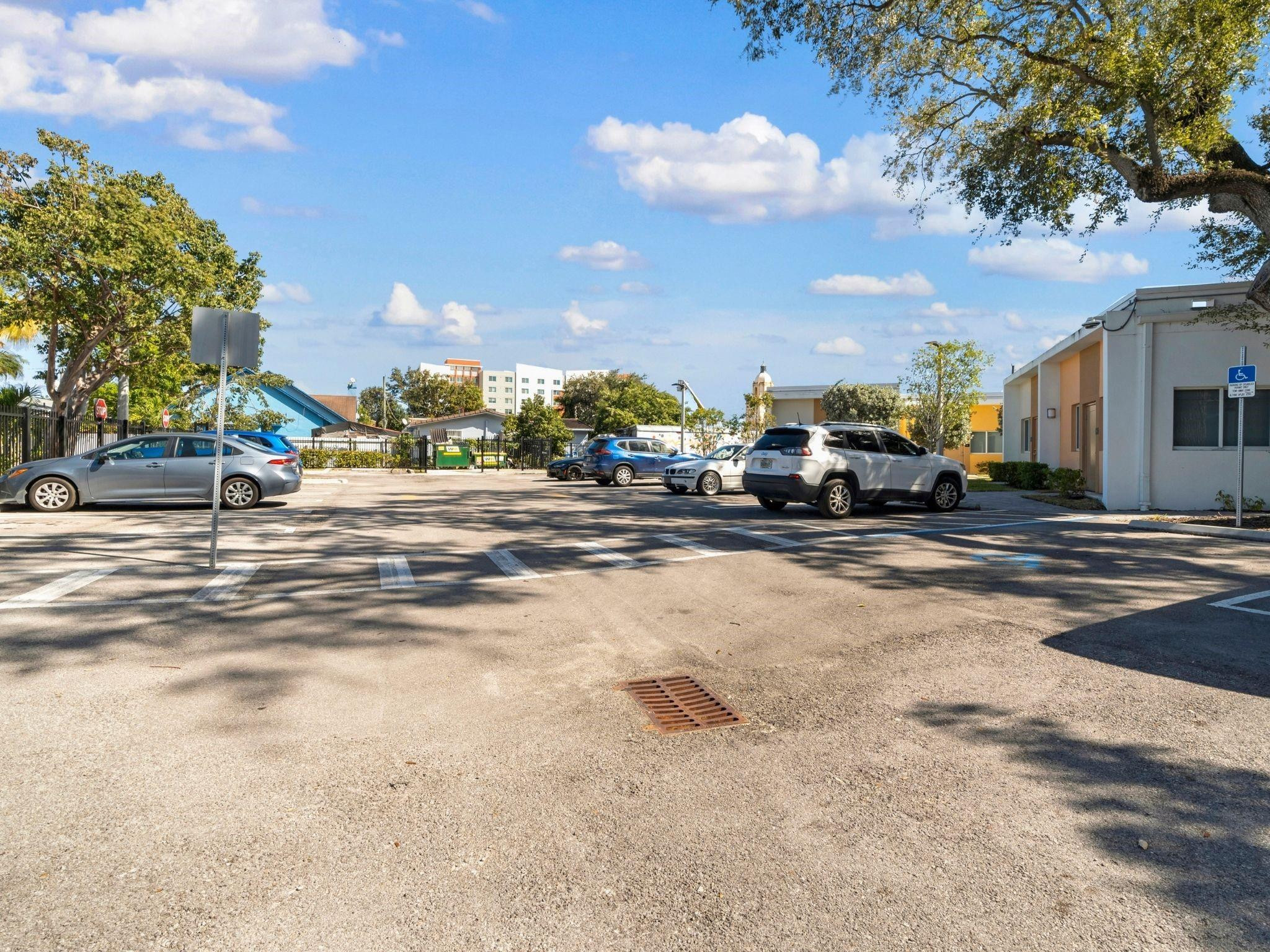 2130 Northwest 37th Street, Unit STUDIO Miami, FL 33142 - Photo 13 of 17 a view of a street with a building in the background