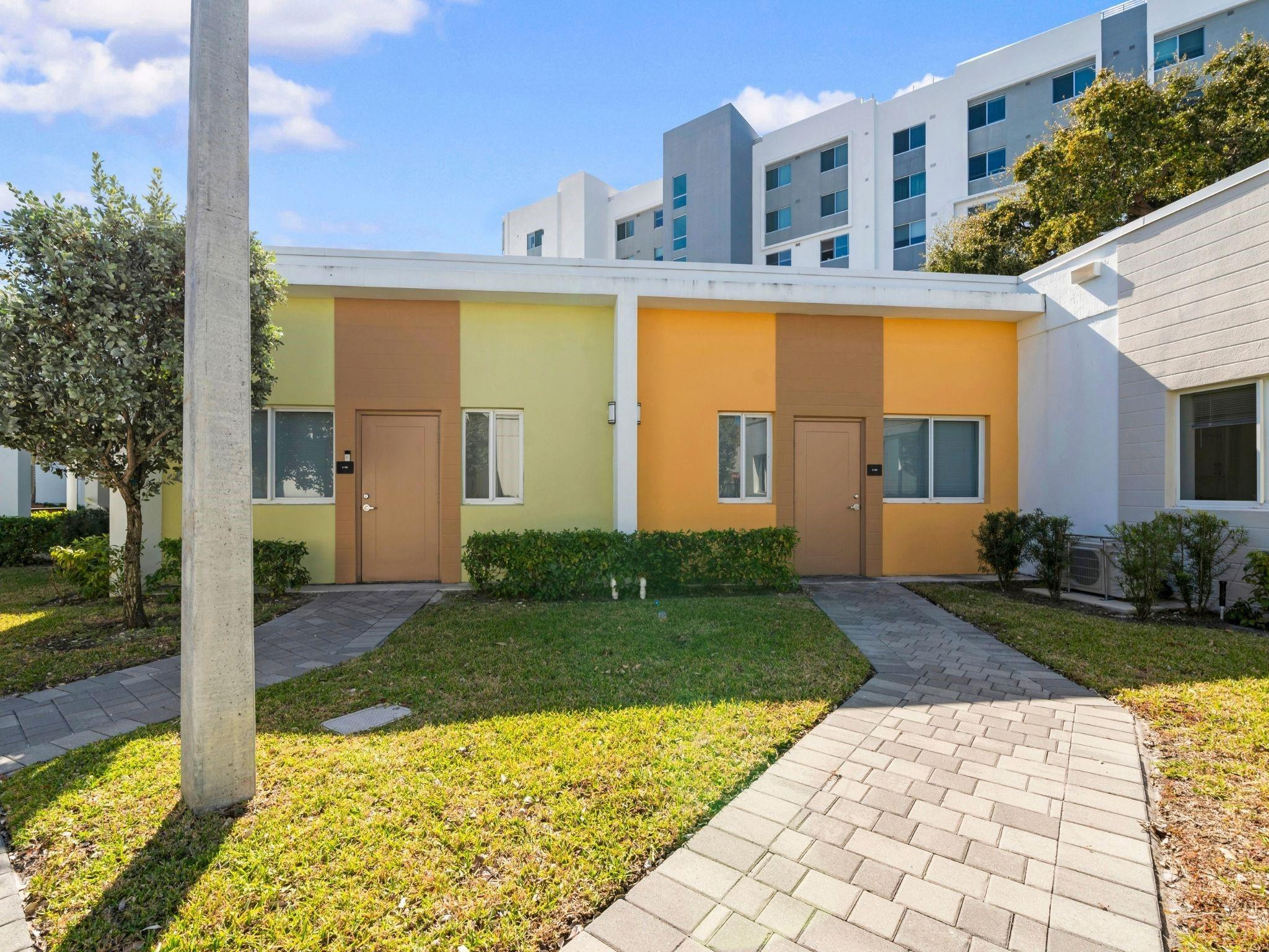 2130 Northwest 37th Street, Unit STUDIO Miami, FL 33142 - Photo 16 of 17 a view of a house with backyard and garden
