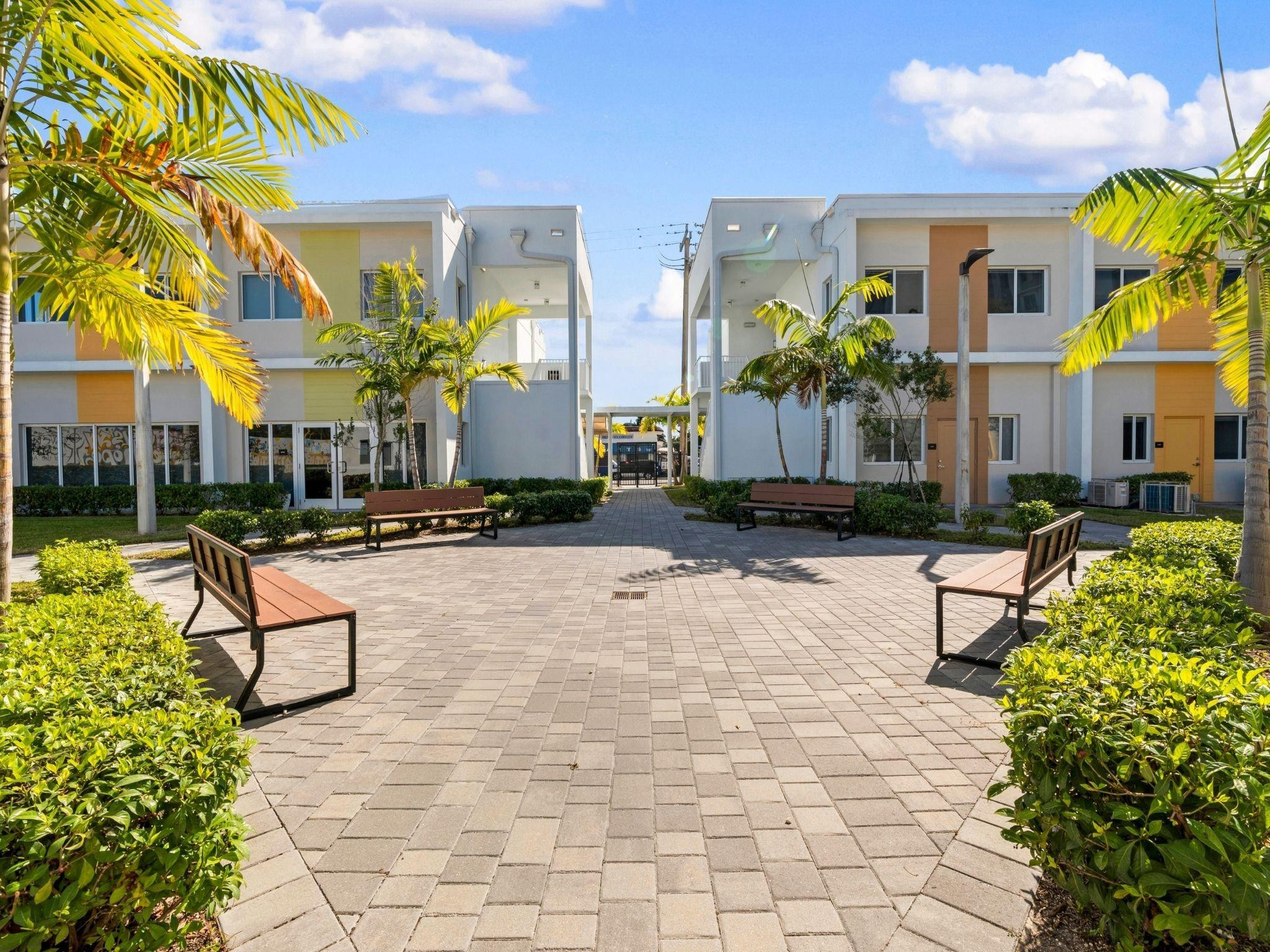 2130 Northwest 37th Street, Unit STUDIO Miami, FL 33142 - Photo 17 of 17 a swimming pool with outdoor seating