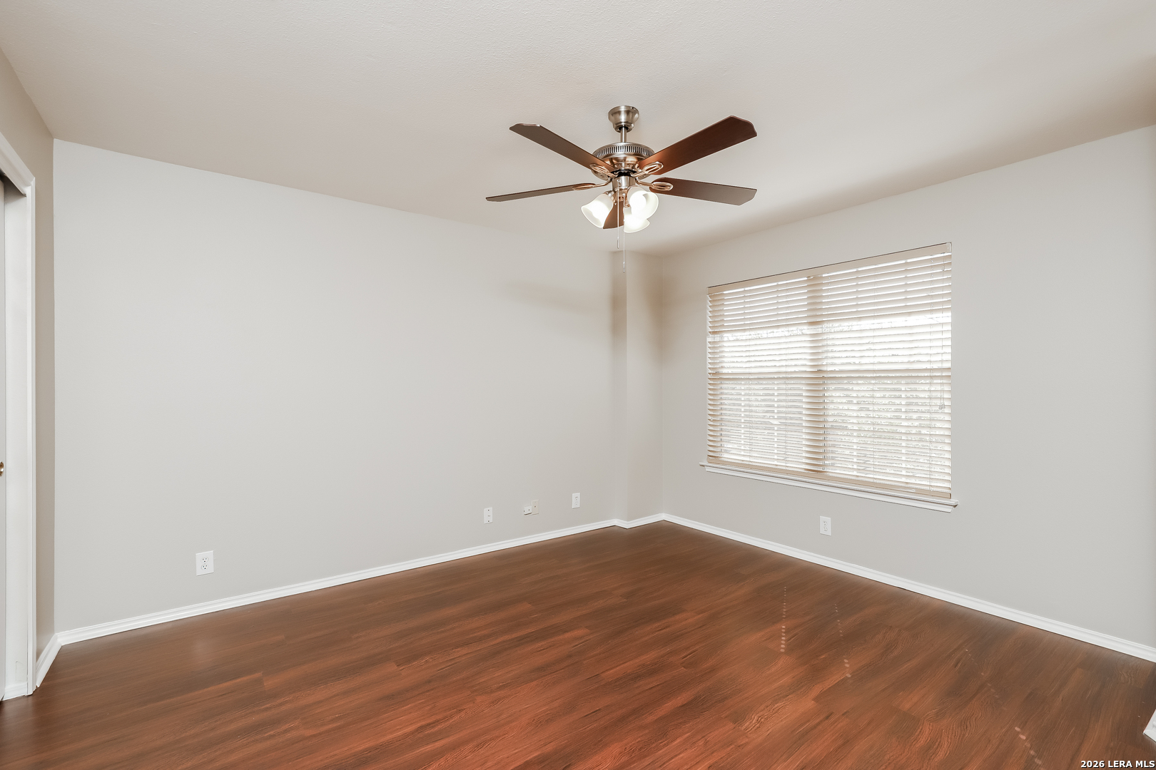 8611 Tioga Pass Helotes, TX 78023 - Photo 5 of 14 a view of a room with wooden floor and windows