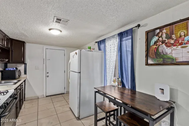 a view of kitchen with furniture and wooden floor