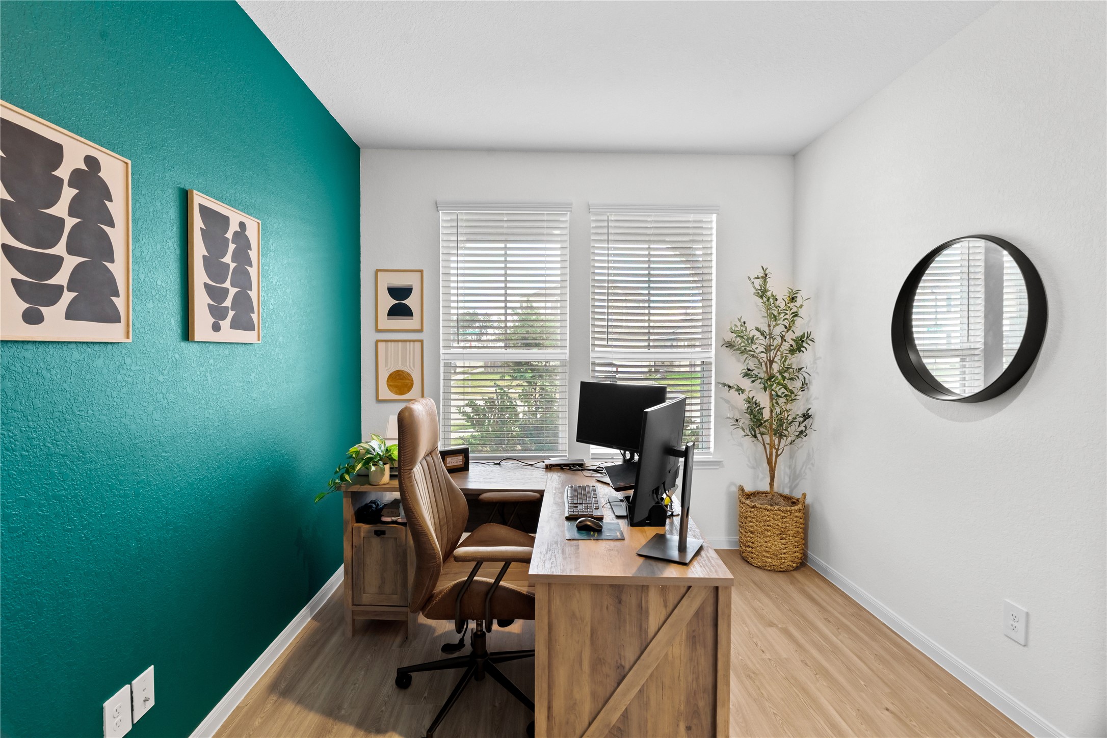 23439 Wrexham Street Spring, TX 77373 - Photo 14 of 26 a view of a workspace with furniture and a window