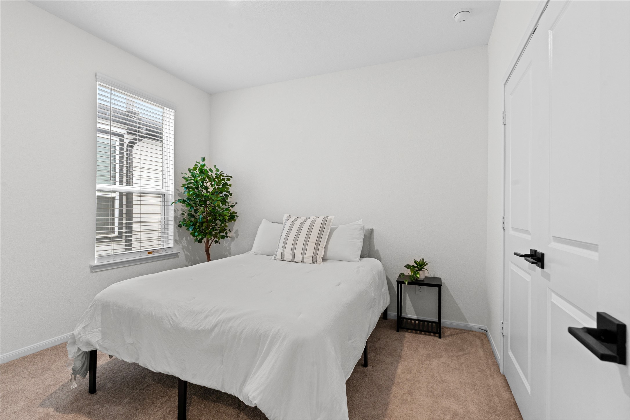 23439 Wrexham Street Spring, TX 77373 - Photo 15 of 26 a bedroom with a bed and a window