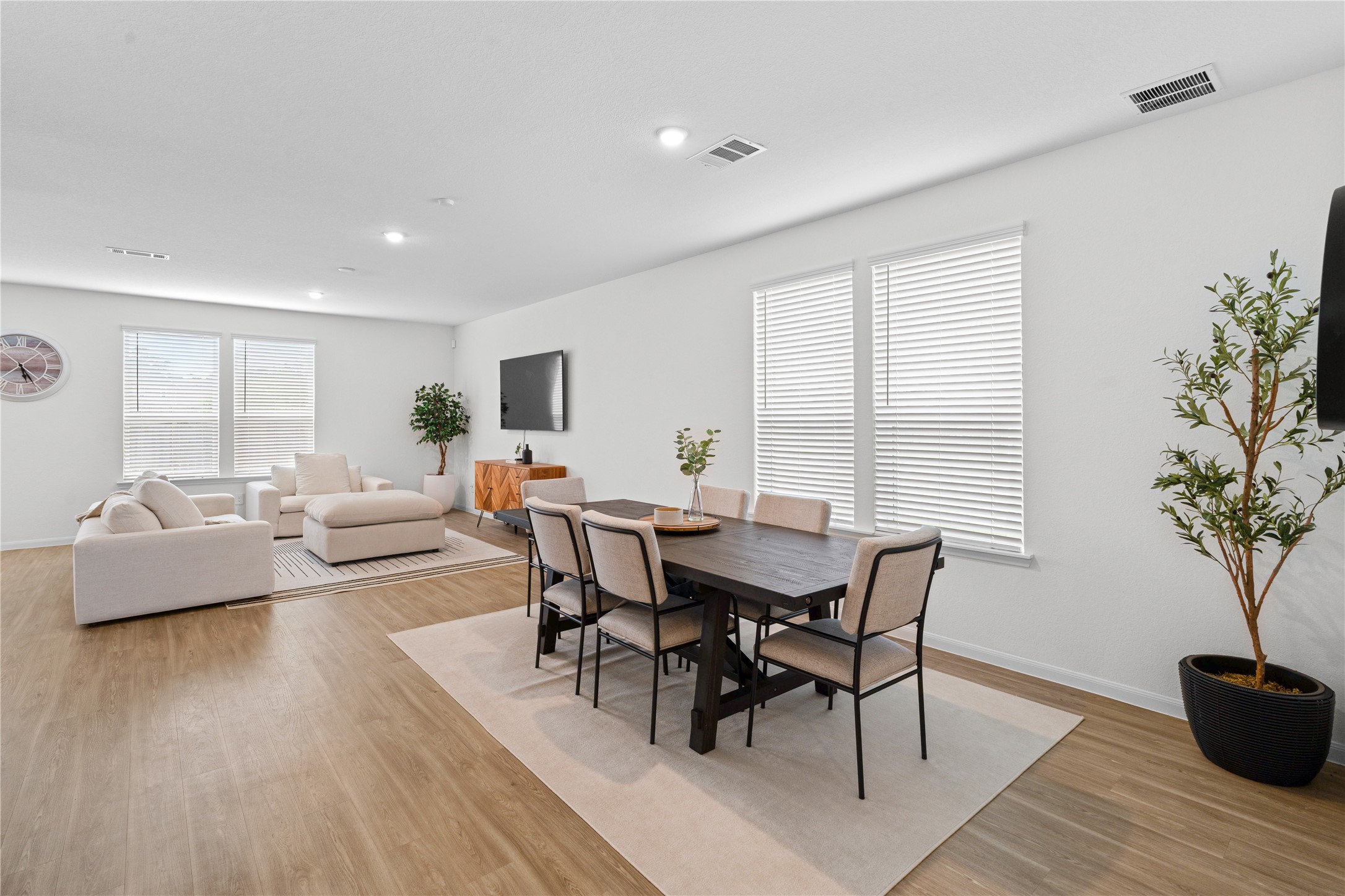 23439 Wrexham Street Spring, TX 77373 - Photo 10 of 26 a view of a dining room with furniture and wooden floor