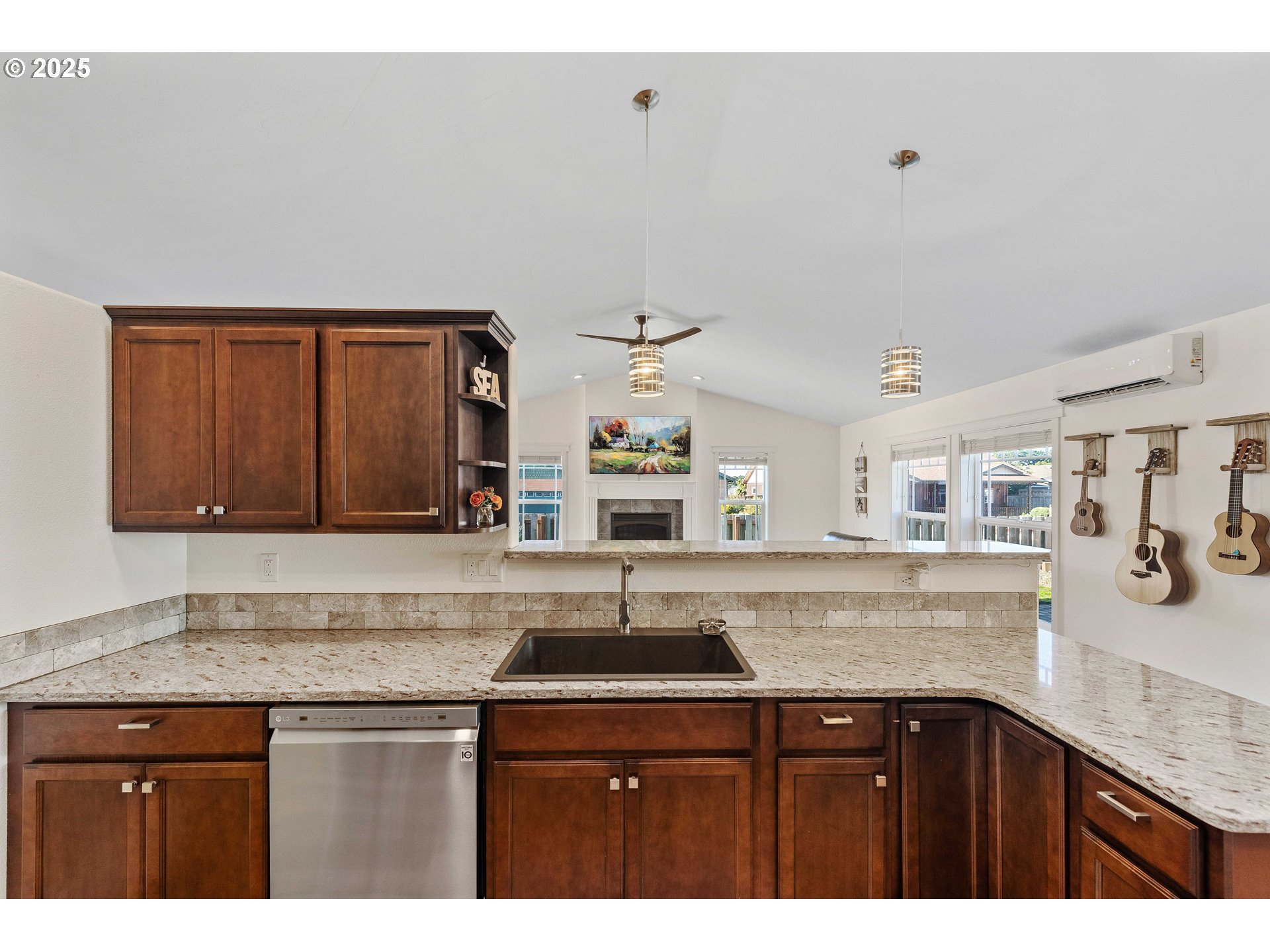 2669 Cedar Loop Bandon, OR 97411 - Photo 12 of 48 a kitchen with granite countertop a sink and cabinets